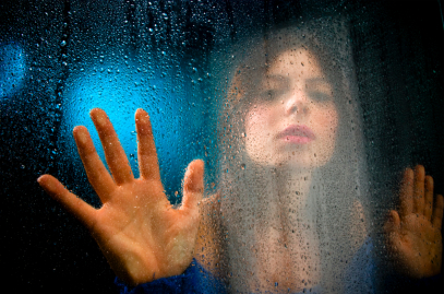 woman touching glass woman touching glass