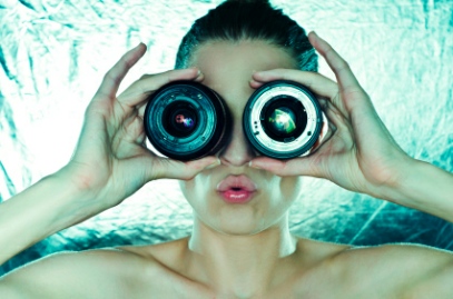 woman with zoom lenses