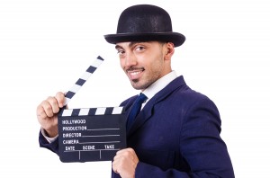picture of man holding clapboard