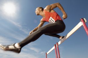 picture of man overcoming hurdle